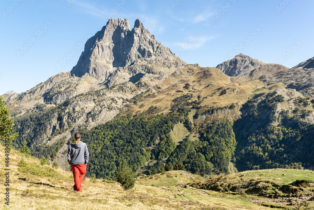 Male hiker in mountains enjoying the views. Active lifestyle. French Pyrenees. 