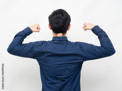 Businessman stand turn back show muscle
