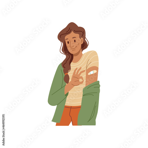 Woman smiling after vaccination, plaster on her shoulder, COVID-19 safety vaccine. Vector happy vaccinated girl showing ok sign, flat cartoon character. Caucasian lady encourage to vaccinate