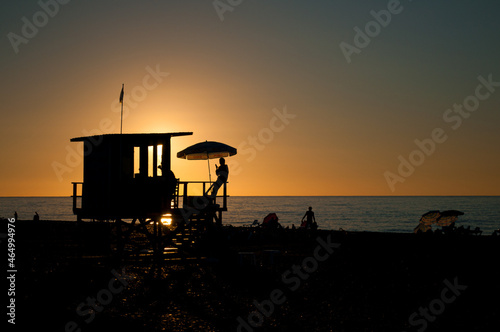 Rescue tower on the beach. Sunset at sea © Andrii_Abriutin