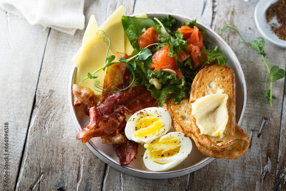 Hard boiled egg, salad and toast for breakfast Hard boiled egg, salad and toast for breakfast