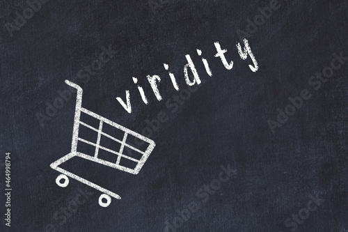 Chalk drawing of shopping cart and word viridity on black chalboard. Concept of globalization and mass consuming photo