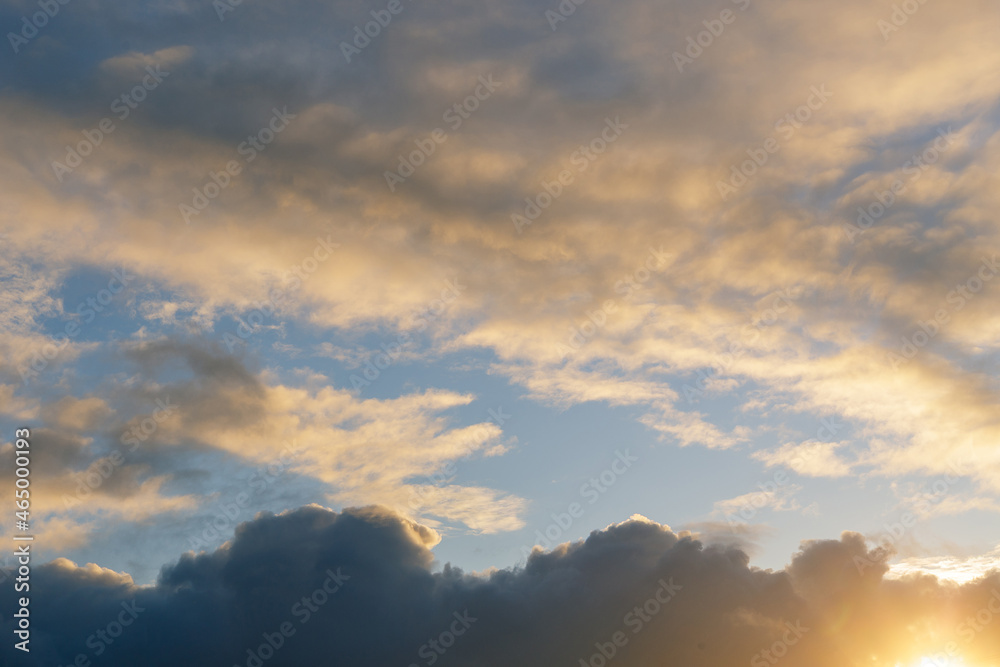 A gray autumn sky with thunderclouds and sunshine. Ready for use with «Sky Replacement» feature in the Adobe Photoshop.