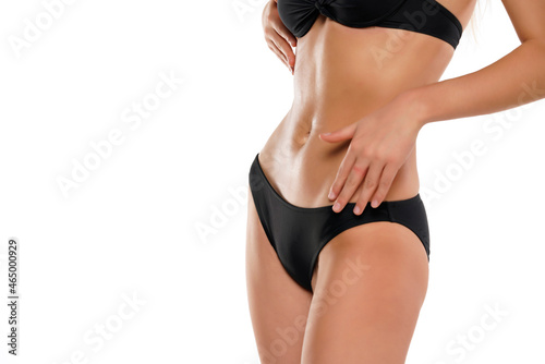 Female torso in a black swimsuit bikini