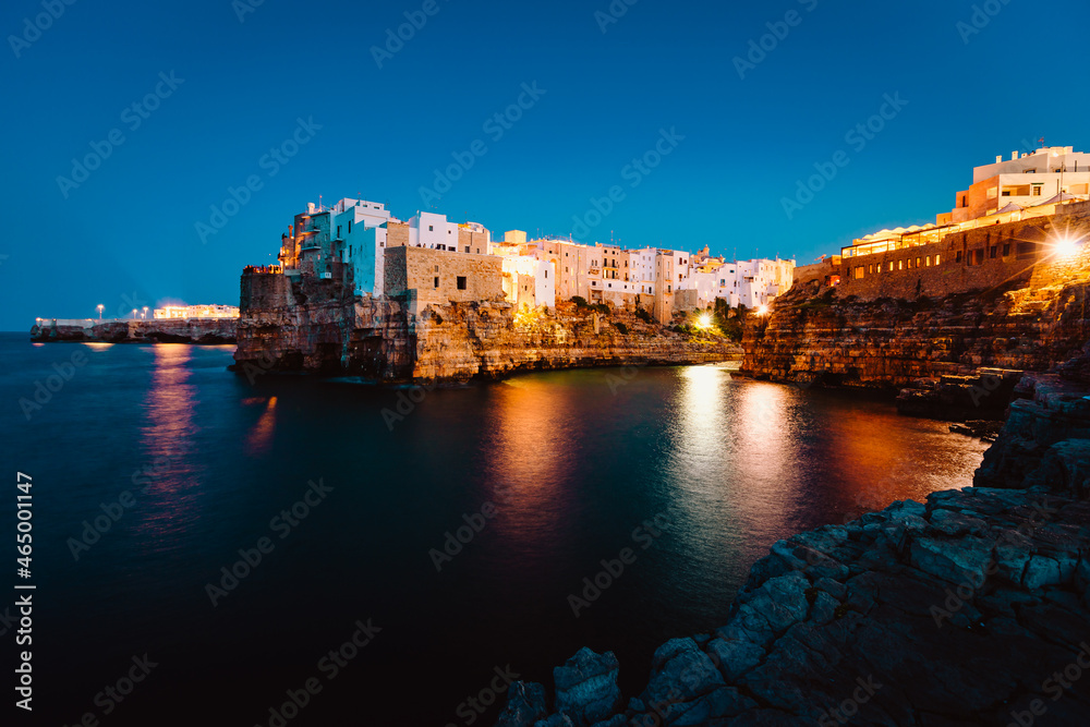 Night view of the village of Polignano a Mare illuminated by the lights
