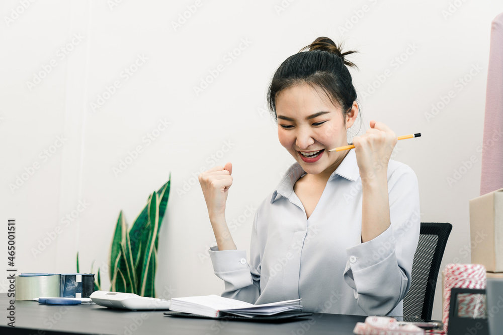 Young asian entrepreneurs are acting of joy as they sell their clothes on target. Young asian entrepreneurs are acting of joy as they sell their clothes on target.