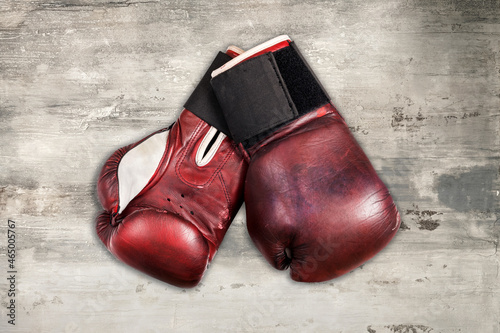 Vintage boxing gloves on wooden surface