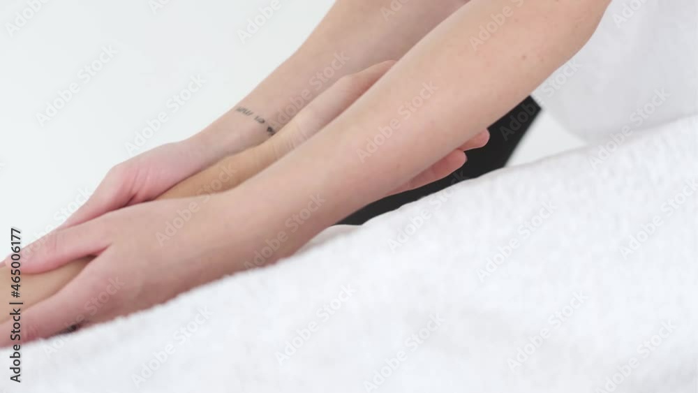 Young woman having massage in beauty spa salon, close up. Hand massage Young woman having massage in beauty spa salon, close up. Hand massage