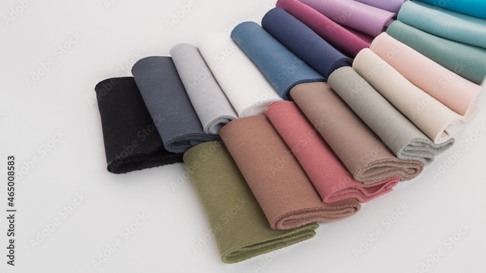 Rolls of bright colored fabric on a white background. Rolls of bright colored fabric on a white background.