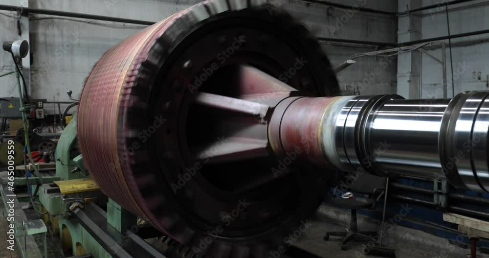 Huge electric motor spinning at the production shop of the factory Huge electric motor spinning at the production shop of the factory