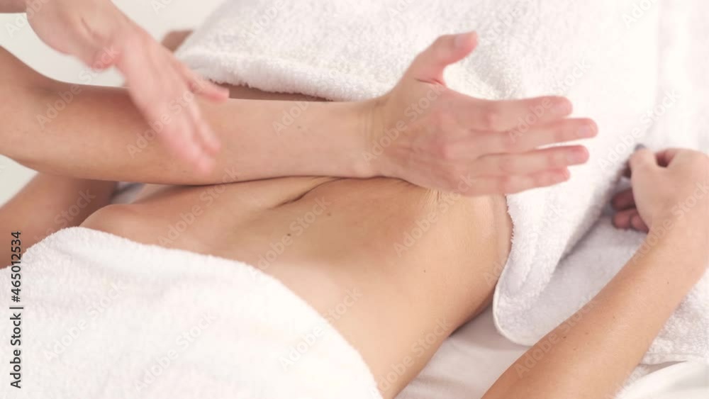 Young woman having massage in beauty spa salon, close up. Back and neck massage Young woman having massage in beauty spa salon, close up. Back and neck massage