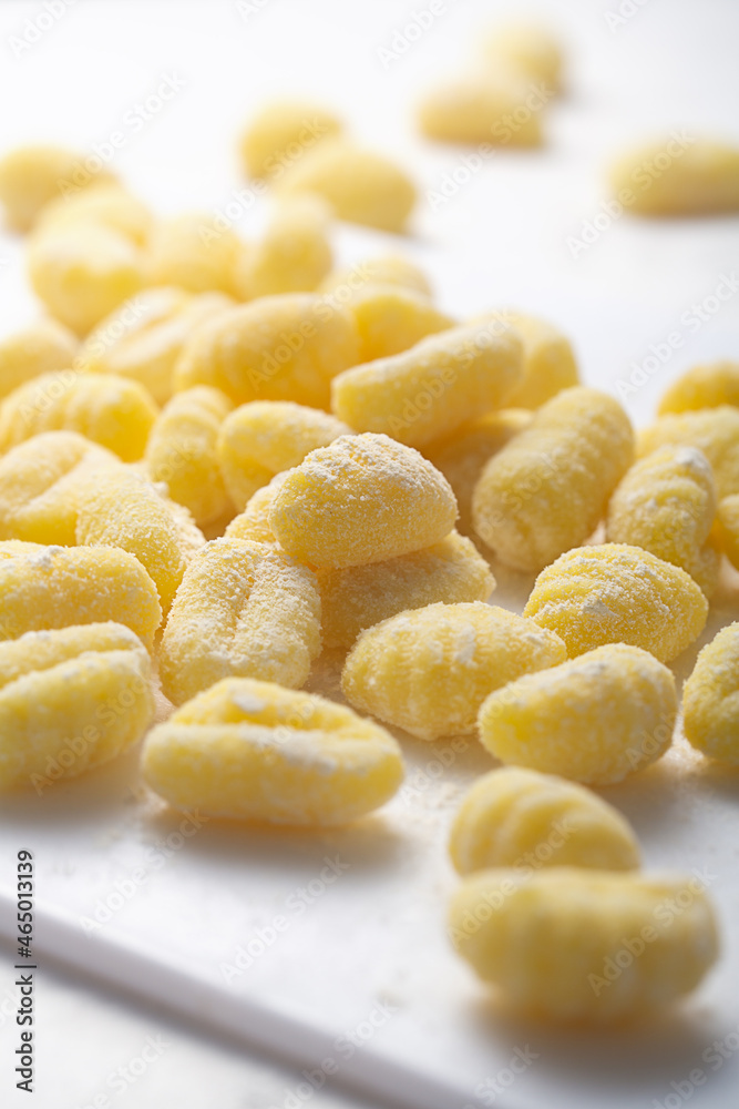 Raw italian gnocchi on a white background Raw italian gnocchi on a white background