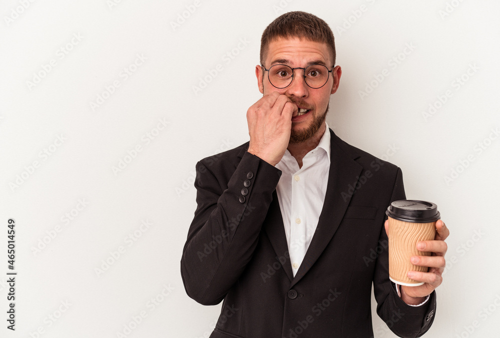 Young business caucasian man holding take away coffee isolated on white background biting fingernails, nervous and very anxious. Young business caucasian man holding take away coffee isolated on white background biting fingernails, nervous and very anxious.