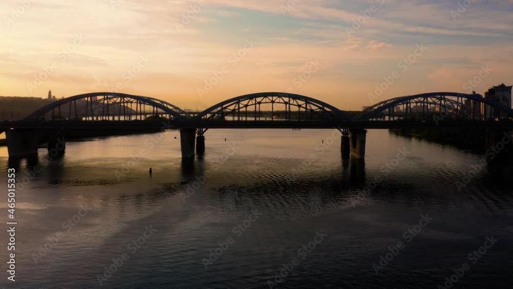 Side view of a city bridge with evening sunset sky. Side view of a city bridge with evening sunset sky.