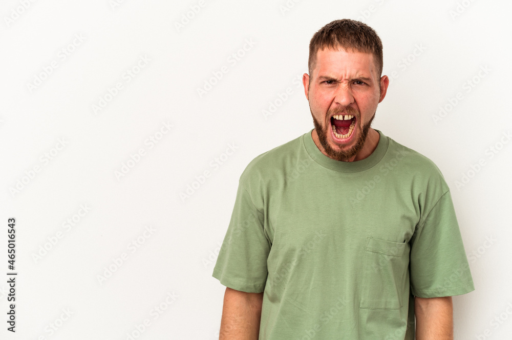 Young caucasian man with diastema isolated on white background shouting very angry, rage concept, frustrated. Young caucasian man with diastema isolated on white background shouting very angry, rage concept, frustrated.