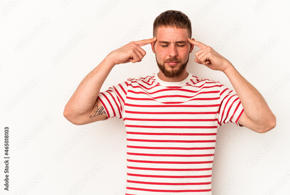 Young caucasian man with diastema isolated on white background focused on a task, keeping forefingers pointing head. Young caucasian man with diastema isolated on white background focused on a task, keeping forefingers pointing head.