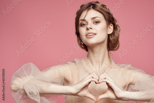 cheerful woman in dress gesturing with hands elegant style glamor