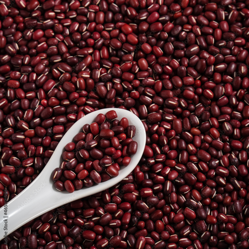 Raw adzuki red bean as background with spoon. Raw adzuki red bean as background with spoon.