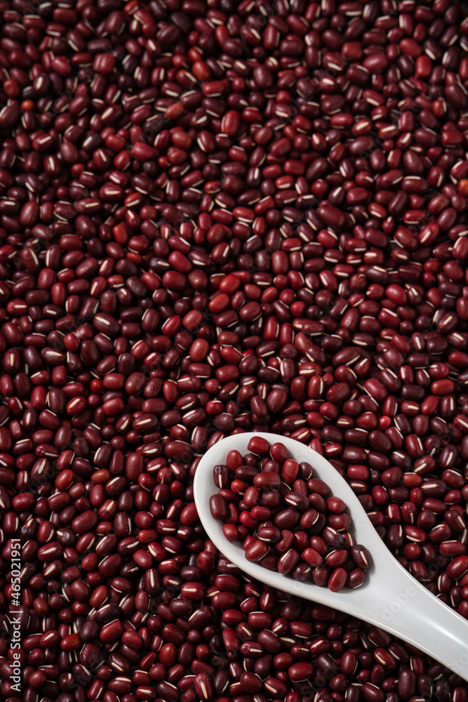 Raw adzuki red bean as background with spoon. Raw adzuki red bean as background with spoon.