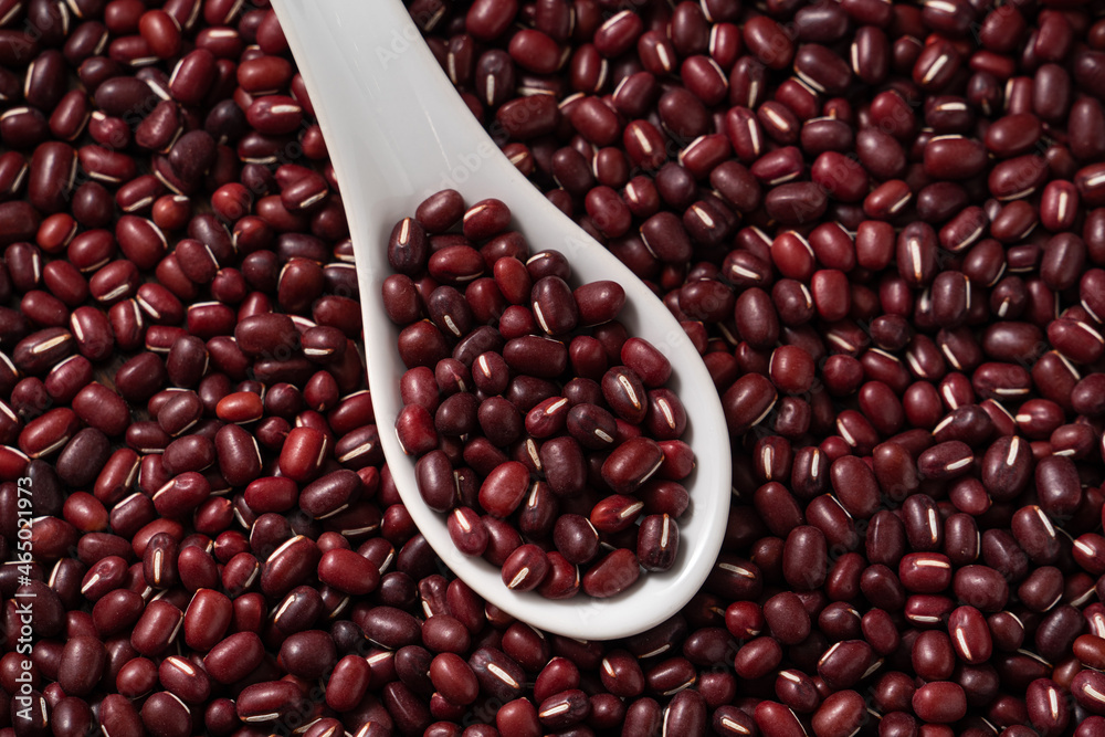Raw adzuki red bean as background with spoon. Raw adzuki red bean as background with spoon.