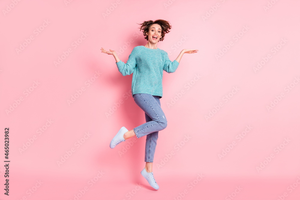Full length body size photo girl childish careless playful happy jumping high isolated pastel pink color background
