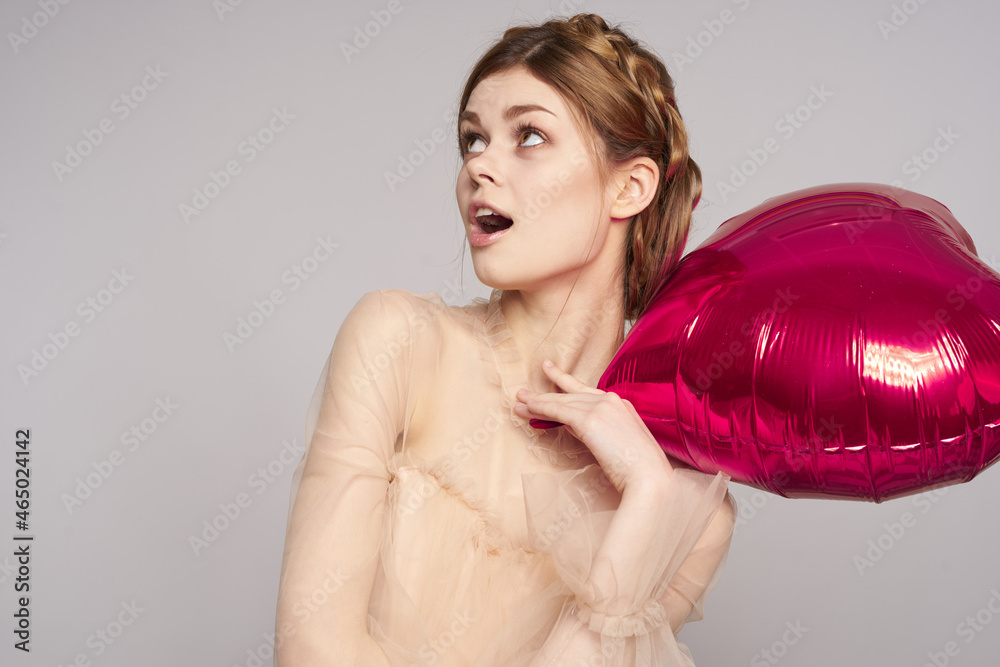 pretty woman red heart in the hands of the balloon isolated background pretty woman red heart in the hands of the balloon isolated background