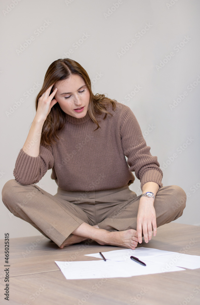 business woman sitting at the table with pencil in hand business woman sitting at the table with pencil in hand
