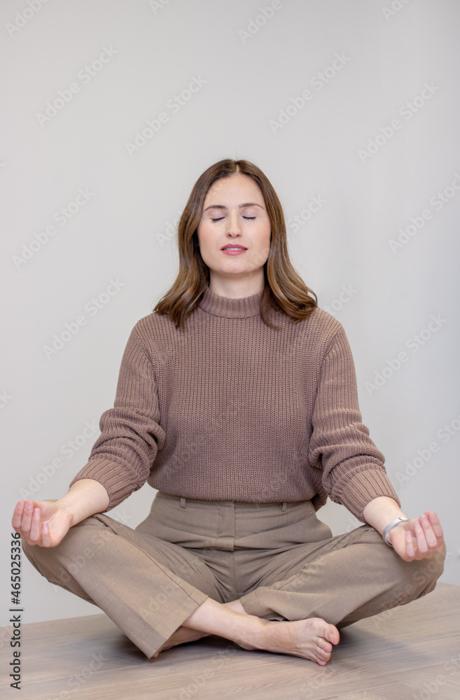 Meditation in the office, meditation on the desk, business woman meditating