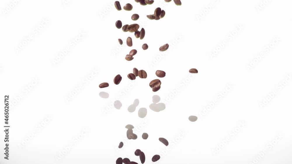 Super Slow Motion Coffee Beans falling from scoop on White Background at 1000fps Super Slow Motion Coffee Beans falling from scoop on White Background at 1000fps