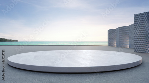 Empty concrete floor and round white podium. 3d rendering of sea view plaza with clear sky background. photo