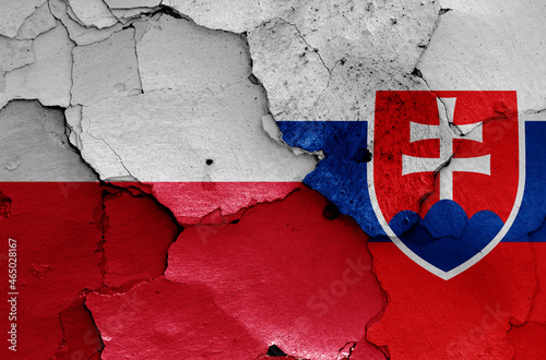 flags of Poland and Slovakia painted on cracked wall