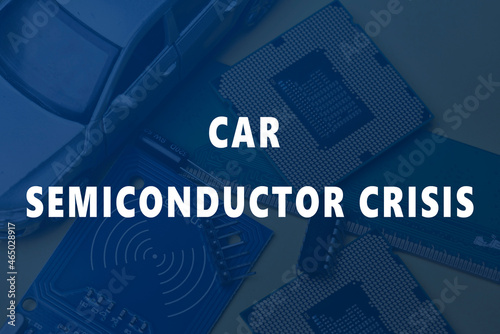 CPU chip and semiconductors with car toy. Global car chip shortage. Micro-chip shortage creates dearth of new cars. Computer chip shortage stalls car industry production