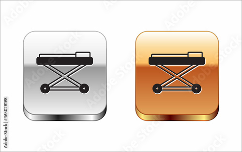 Black Stretcher icon isolated on white background. Patient hospital medical stretcher. Silver and gold square buttons. Vector