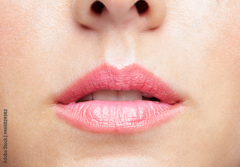Closeup macro portrait of female part of face. Human woman lips with day beauty makeup Closeup macro portrait of female part of face. Human woman lips with day beauty makeup