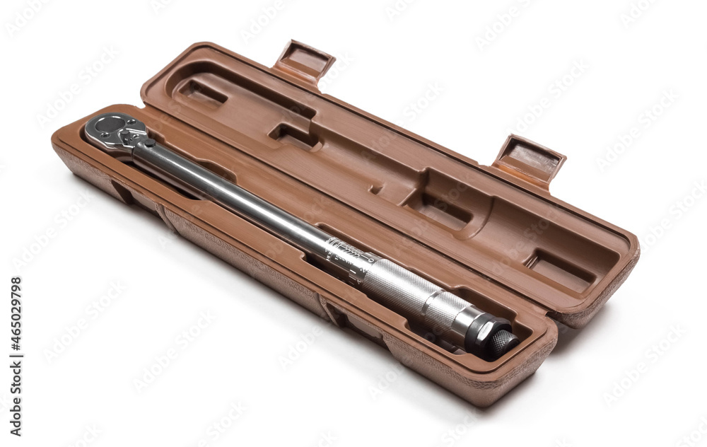 A torque wrench in a case. Close up. Isolated on a white background A torque wrench in a case. Close up. Isolated on a white background