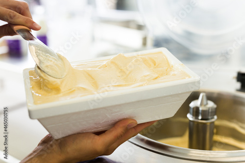 Vanilla ice cream in thermal insulation packaging at factory
