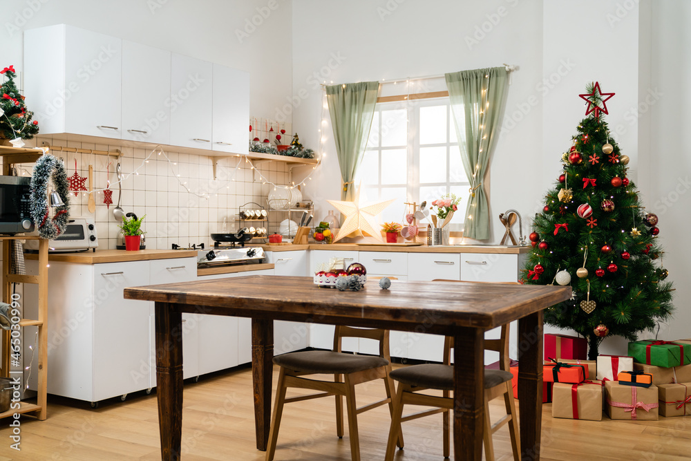 interior of a modern festive kitchen with wood furniture and window ...
