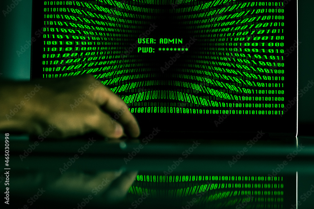 Hand typing on a laptop keyboard green numbers on display. Successful login with credentials user and password in the system. Technology communication, security protection, hacker, cyber crime concept Hand typing on a laptop keyboard green numbers on display. Successful login with credentials user and password in the system. Technology communication, security protection, hacker, cyber crime concept