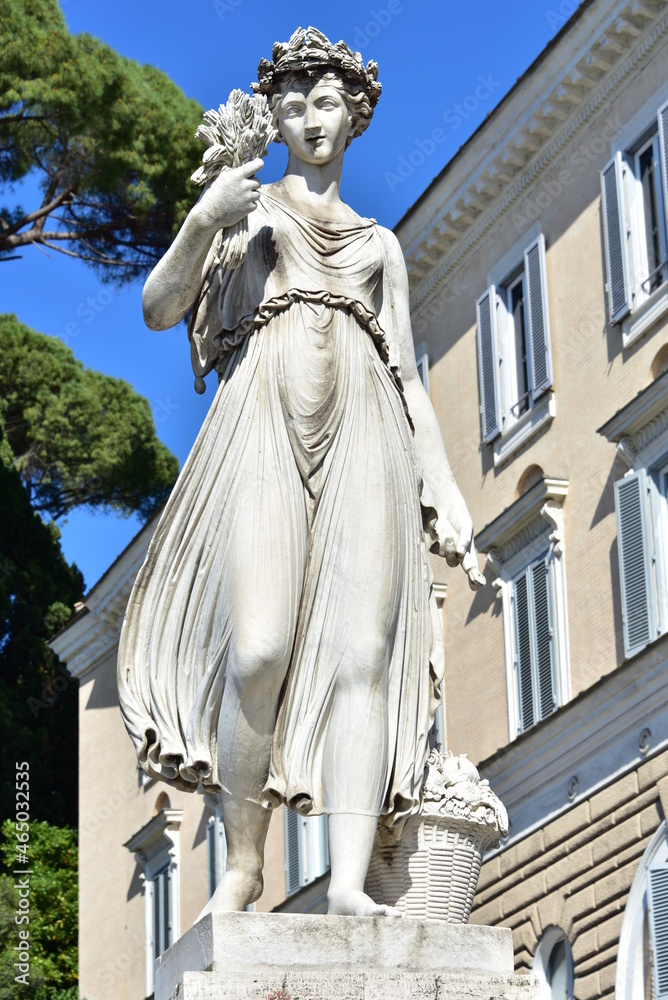 Allegory statue of spring, in Piazza del Popolo in Rome, Italy Allegory statue of spring, in Piazza del Popolo in Rome, Italy