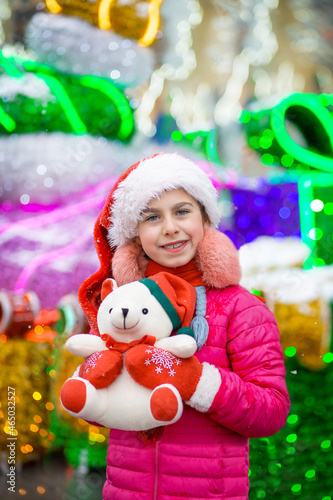 Happy happy laughing child girl with christmas present. Christmas concept. © liubovyashkir
