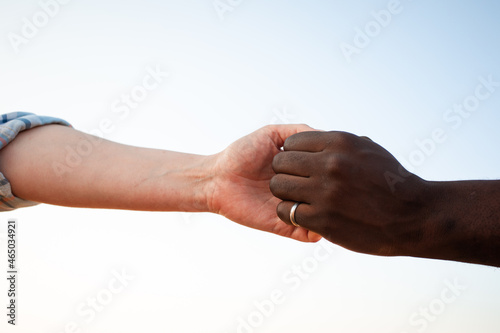 Diverse culture concept. Black man and white woman hands © oksix