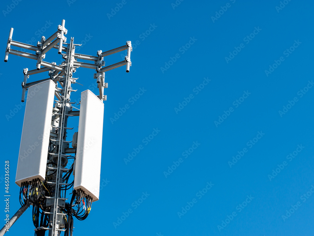 Telecommunications tower, 5g antenna and blue sky