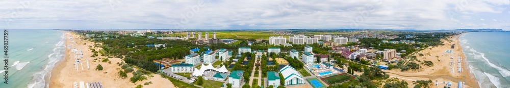 Obraz premium A picturesque panorama of the sea coast with a sandy beach in a resort near the city of Anapa and the village of Vityazevo