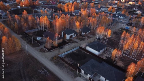 Private houses in the autumn village. The city of Chelyabinsk . Golden Autumn photo