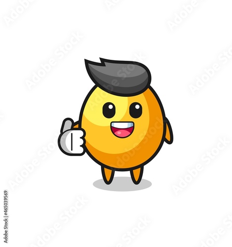 golden egg mascot doing thumbs up gesture