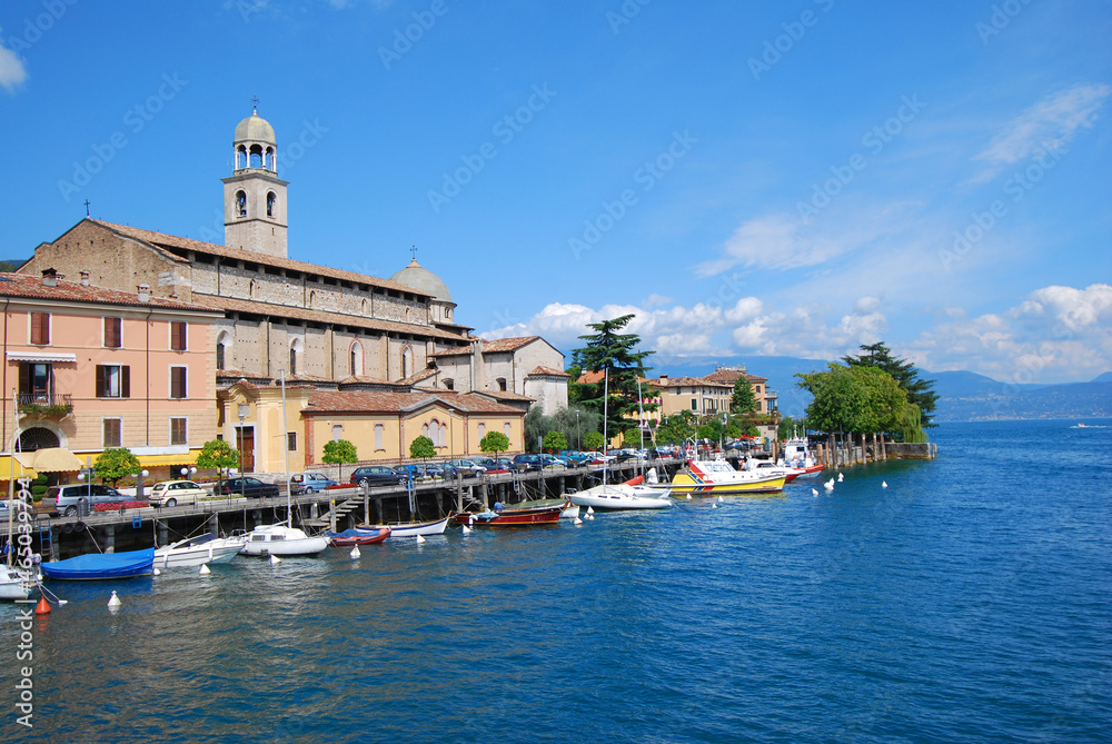 Port promenade with look at the cathedral Santa Maria Annunziata,  Salo, Lake Garda. Italy, Europe