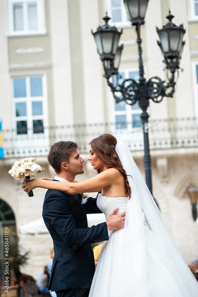 Happy newlywed bride and groom in the old city