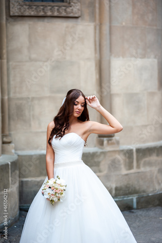 Fashion bride white wedding dress in the old city