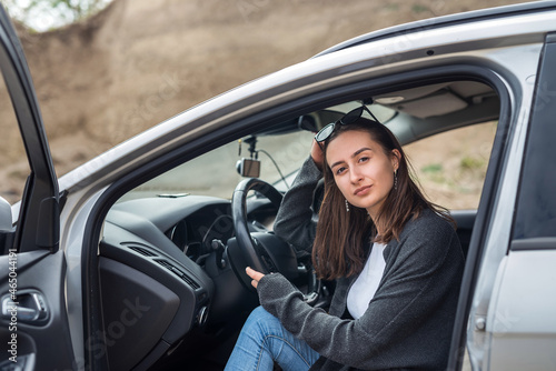 Portrait of pretty woman inside car