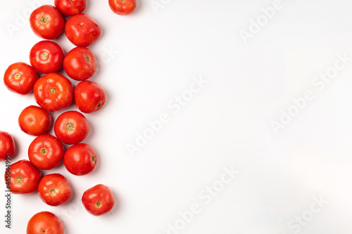 Red fresh tomatoes on a white background space for text